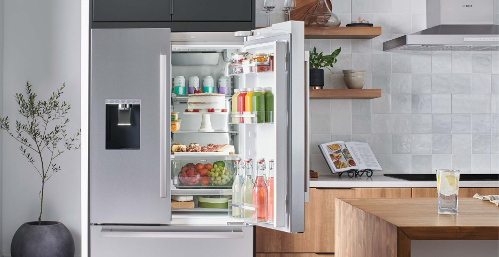 opened fridge with many different types of refreshers and fruits